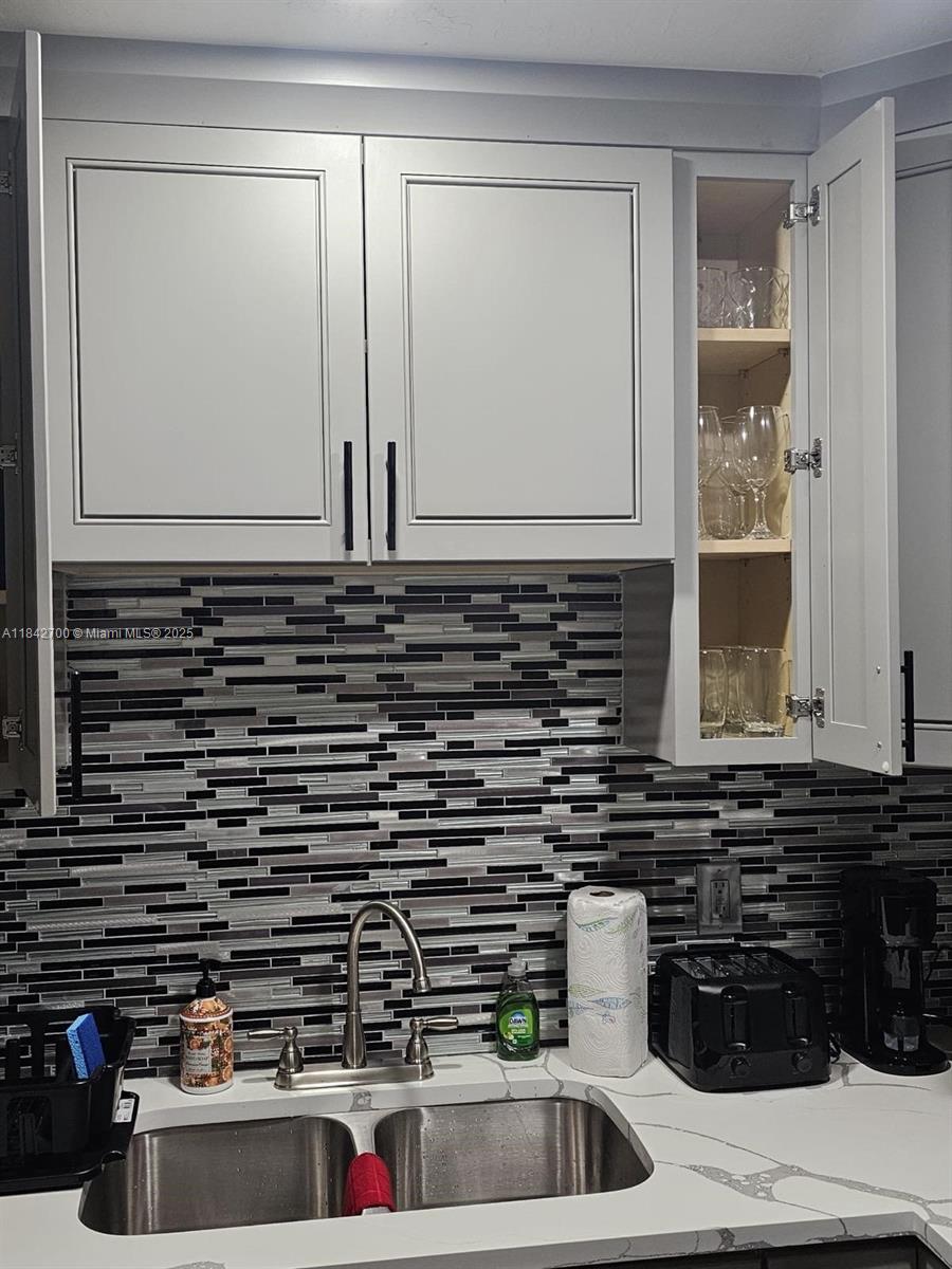 5929 Fillmore Street, Unit A Hollywood, FL 33021 - Photo 4 of 24 a kitchen with a sink and cabinets