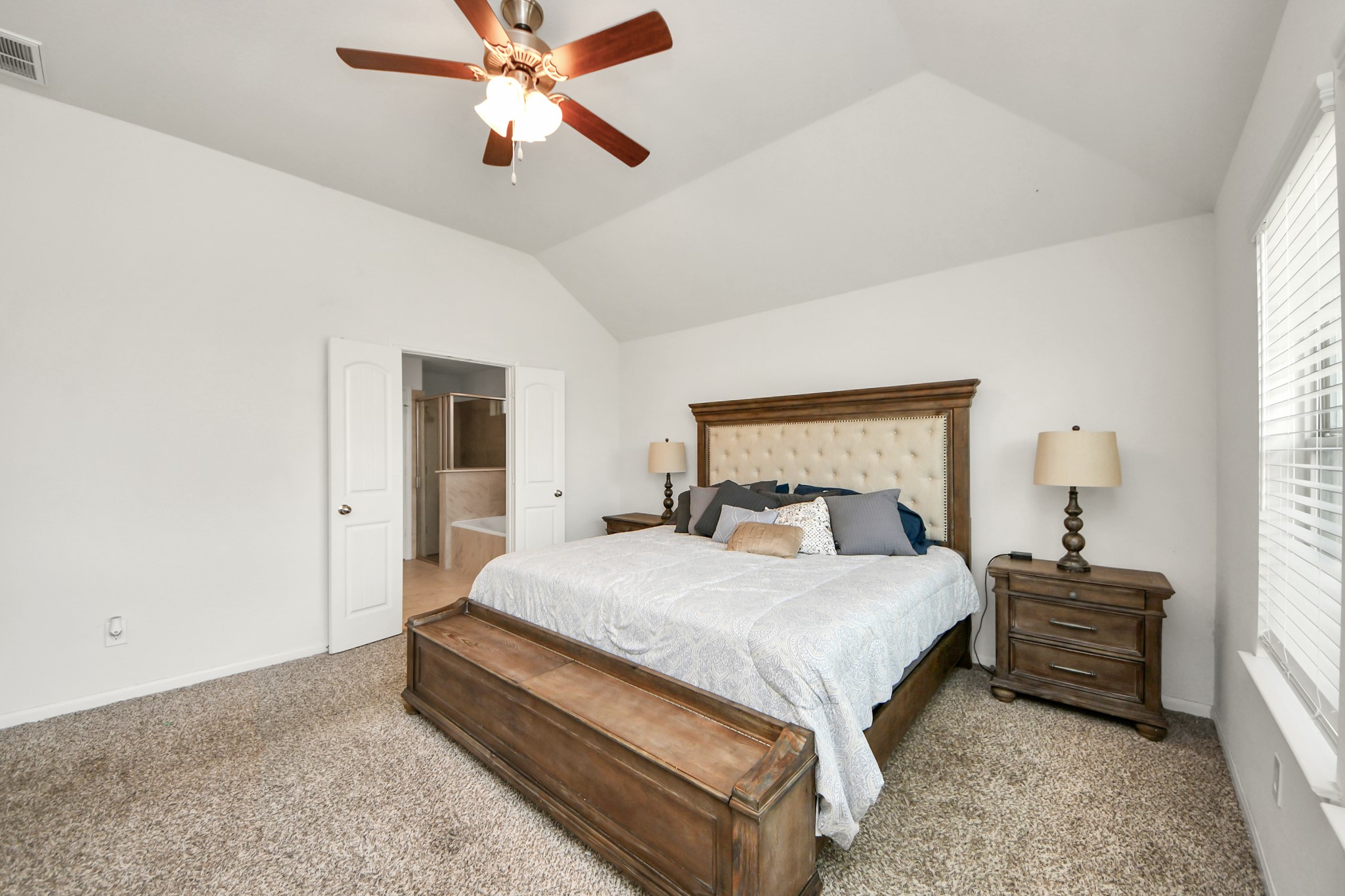 6226 Mason Way Rosenberg, TX 77471 - Photo 13 of 30 a bedroom with a bed and a chandelier