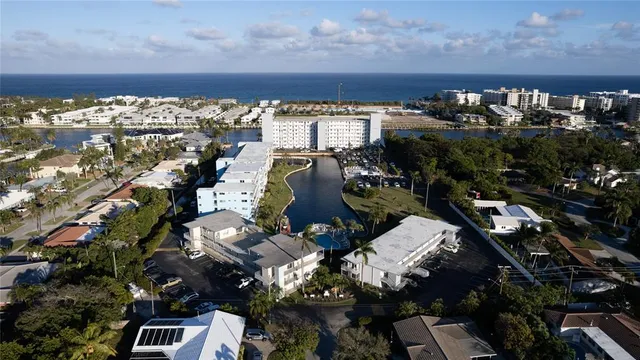 a view of a swimming pool with outdoor seating