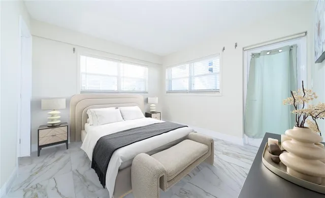 a bedroom with a bed and a couch