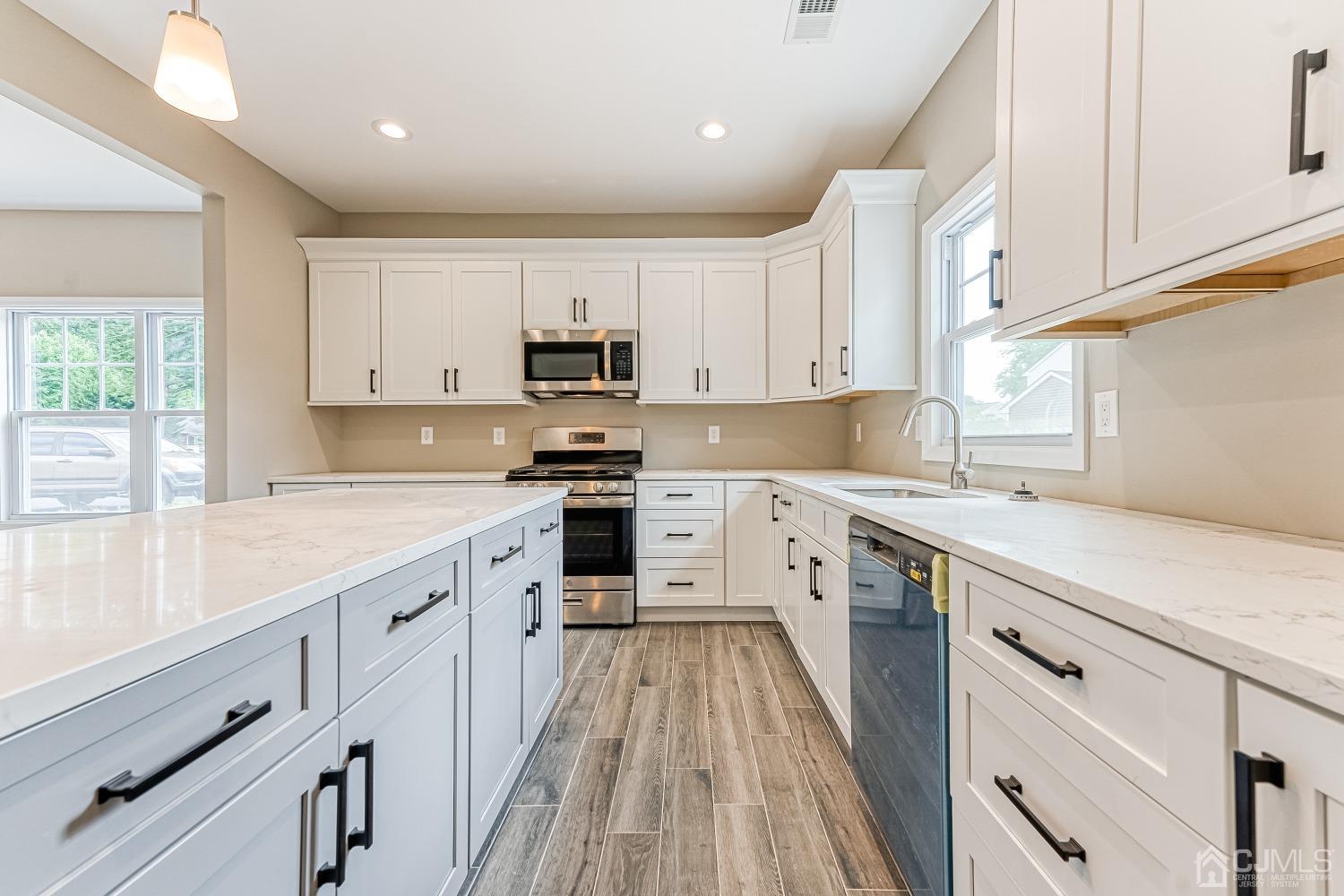 19 Crescent Road Edison, NJ 08817 - Photo 13 of 40 a kitchen with appliances cabinets sink and a window