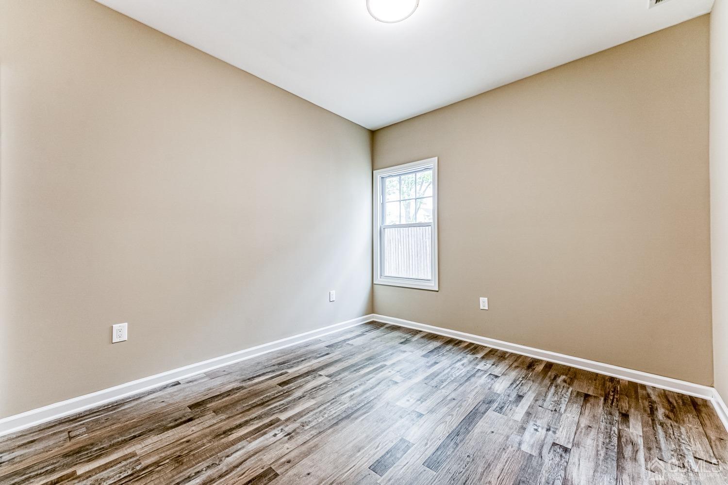 19 Crescent Road Edison, NJ 08817 - Photo 20 of 40 a view of room with window and wooden floor