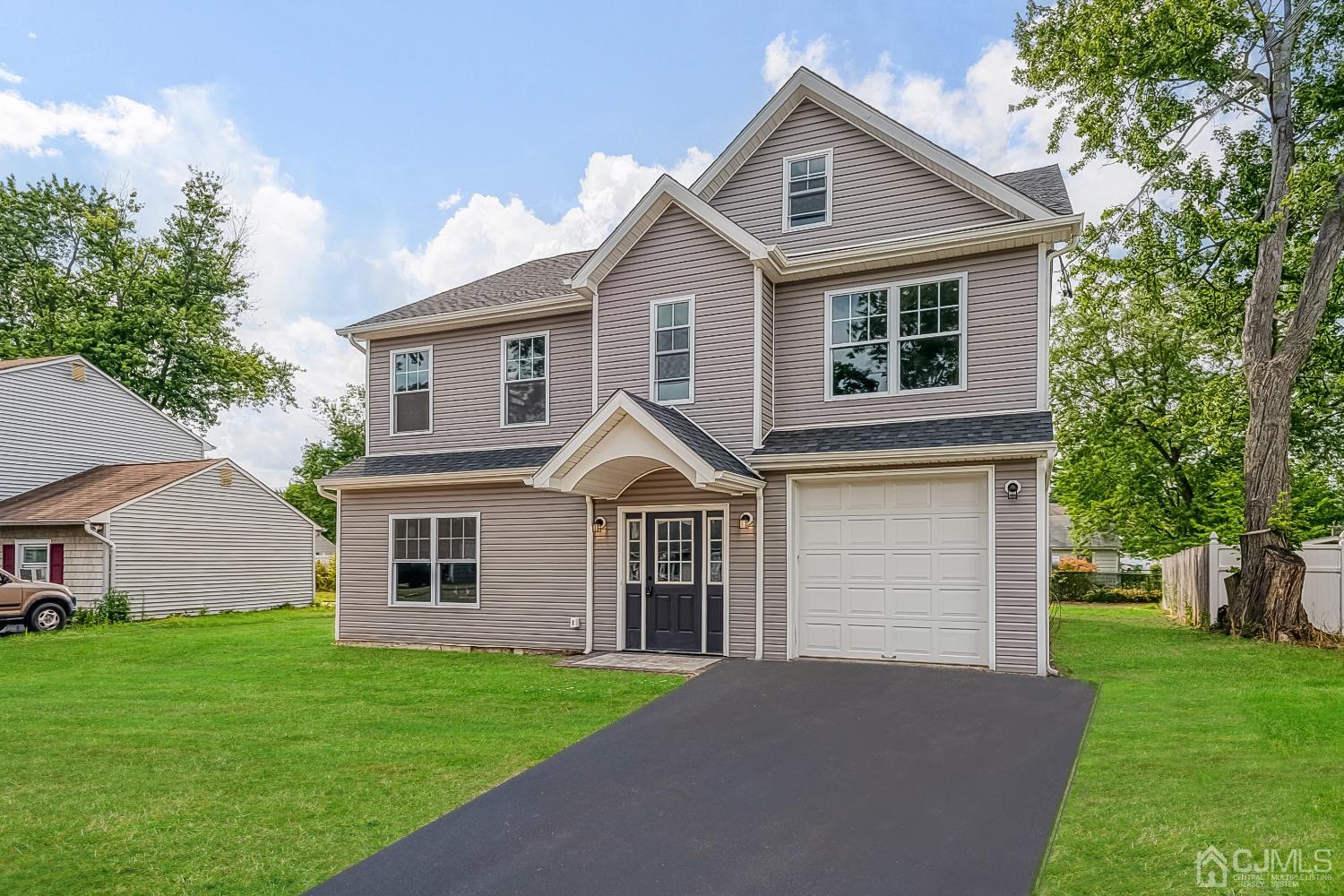 19 Crescent Road Edison, NJ 08817 - Photo 2 of 40 a front view of a house with a garden
