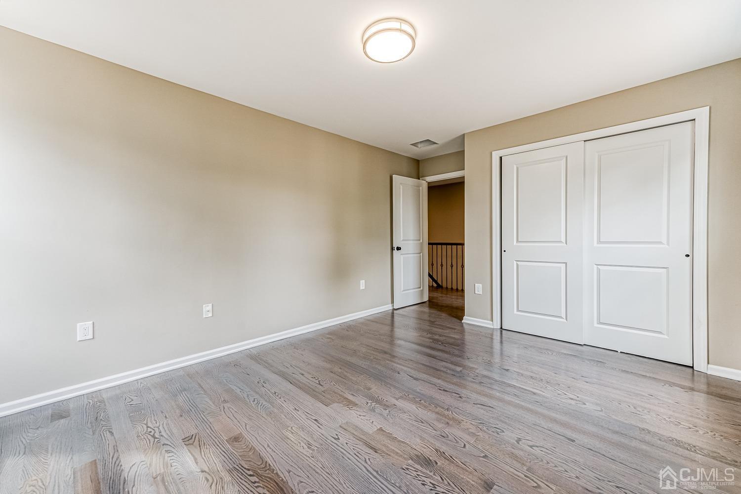 19 Crescent Road Edison, NJ 08817 - Photo 25 of 40 a view of an empty room and wooden floor