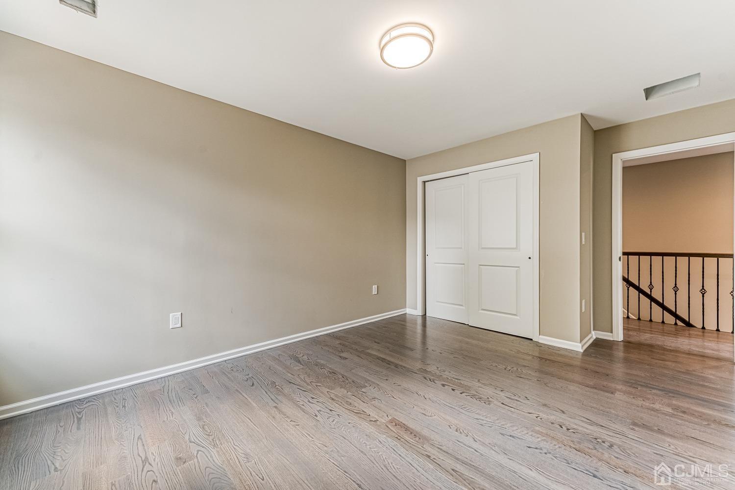19 Crescent Road Edison, NJ 08817 - Photo 28 of 40 a view of an empty room with wooden floor