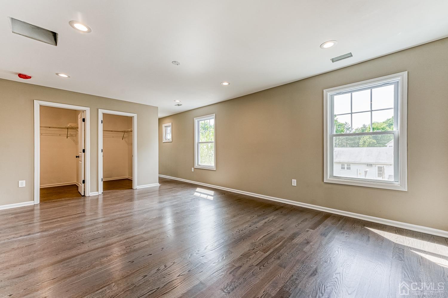 19 Crescent Road Edison, NJ 08817 - Photo 32 of 40 an empty room with wooden floor and windows