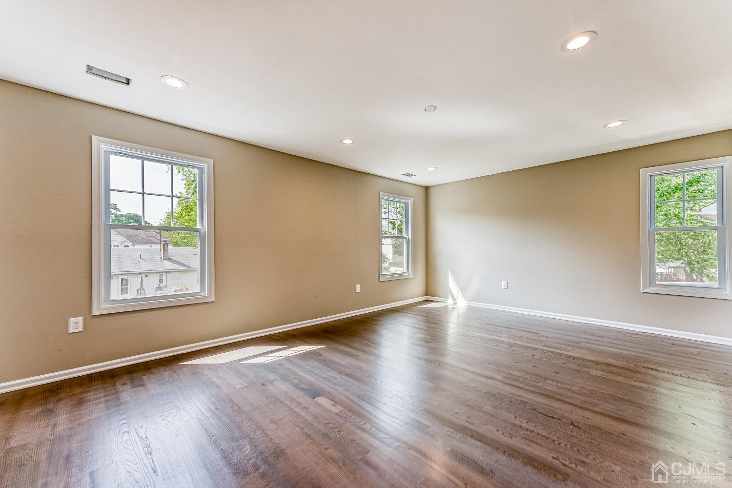 19 Crescent Road Edison, NJ 08817 - Photo 34 of 40 a view of an empty room with wooden floor and a window