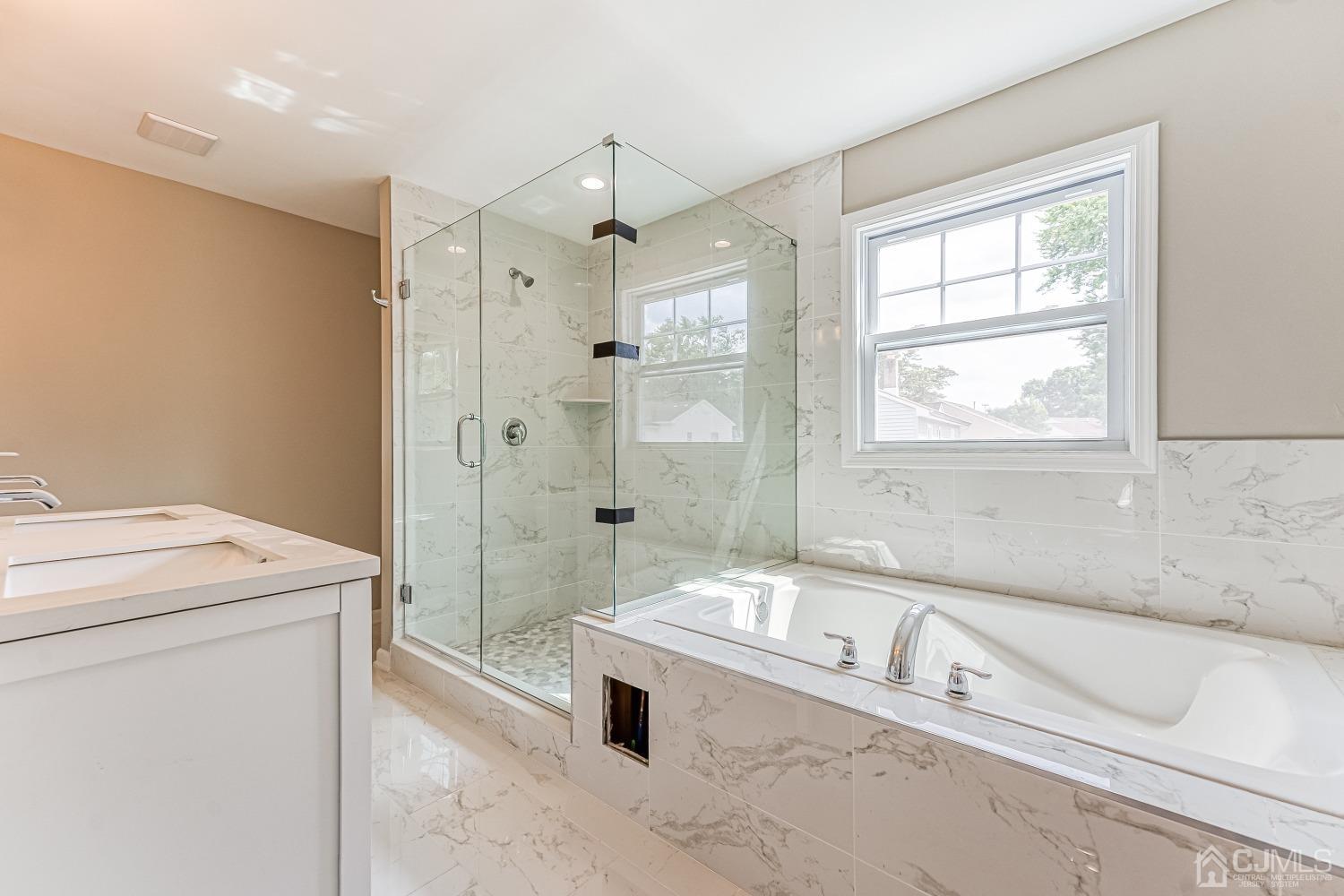 19 Crescent Road Edison, NJ 08817 - Photo 36 of 40 a bathroom with a granite countertop sink a toilet and shower