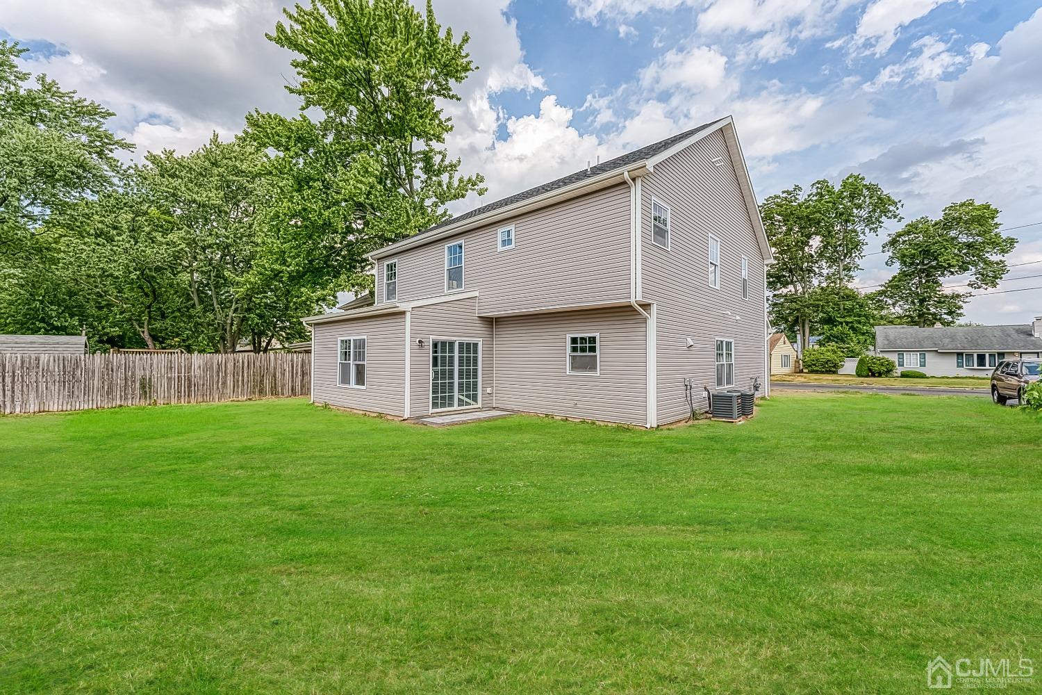 19 Crescent Road Edison, NJ 08817 - Photo 40 of 40 a view of a backyard with plants and large tree