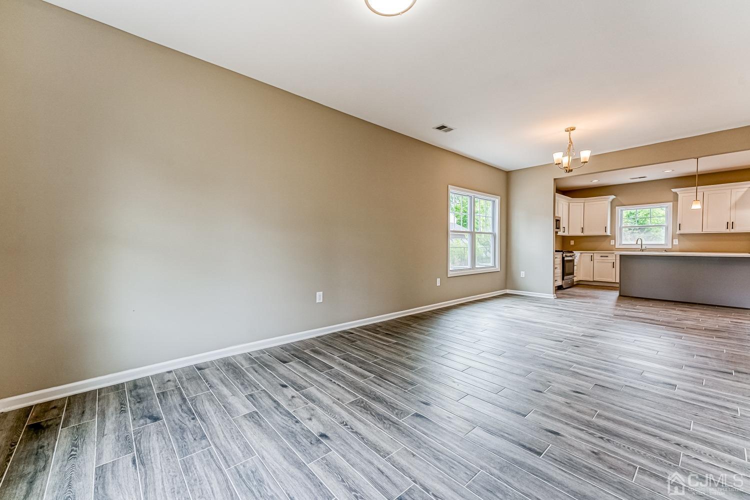 19 Crescent Road Edison, NJ 08817 - Photo 6 of 40 wooden floor in an empty room with a window