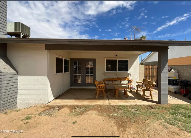 a view of living room with furniture and a window