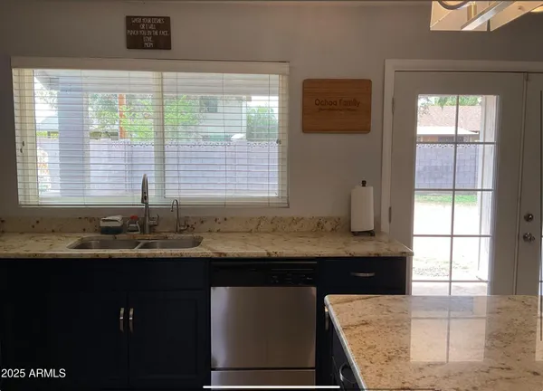 a kitchen with a sink and a window
