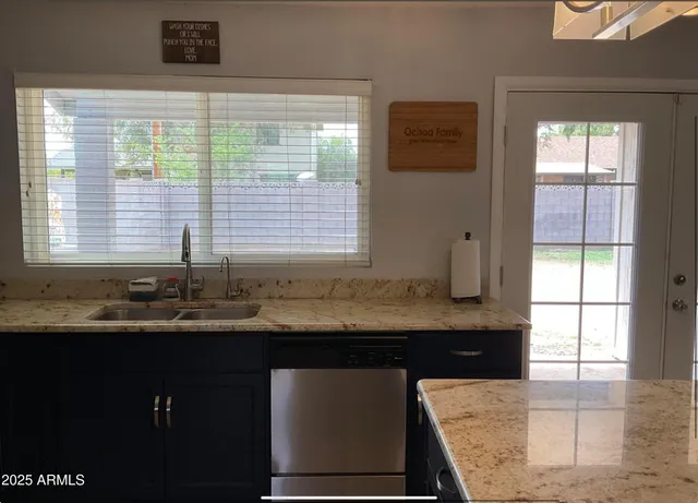 a kitchen with a sink and a window