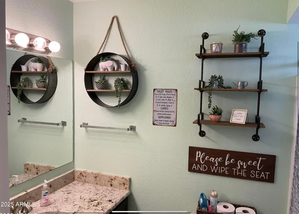 a bathroom with a light fixture and a sink