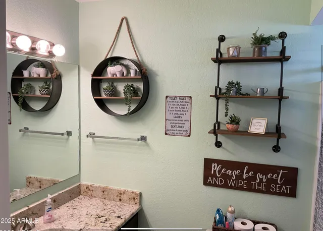 a bathroom with a light fixture and a sink