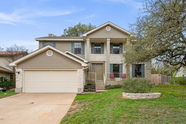 front view of a house with a yard