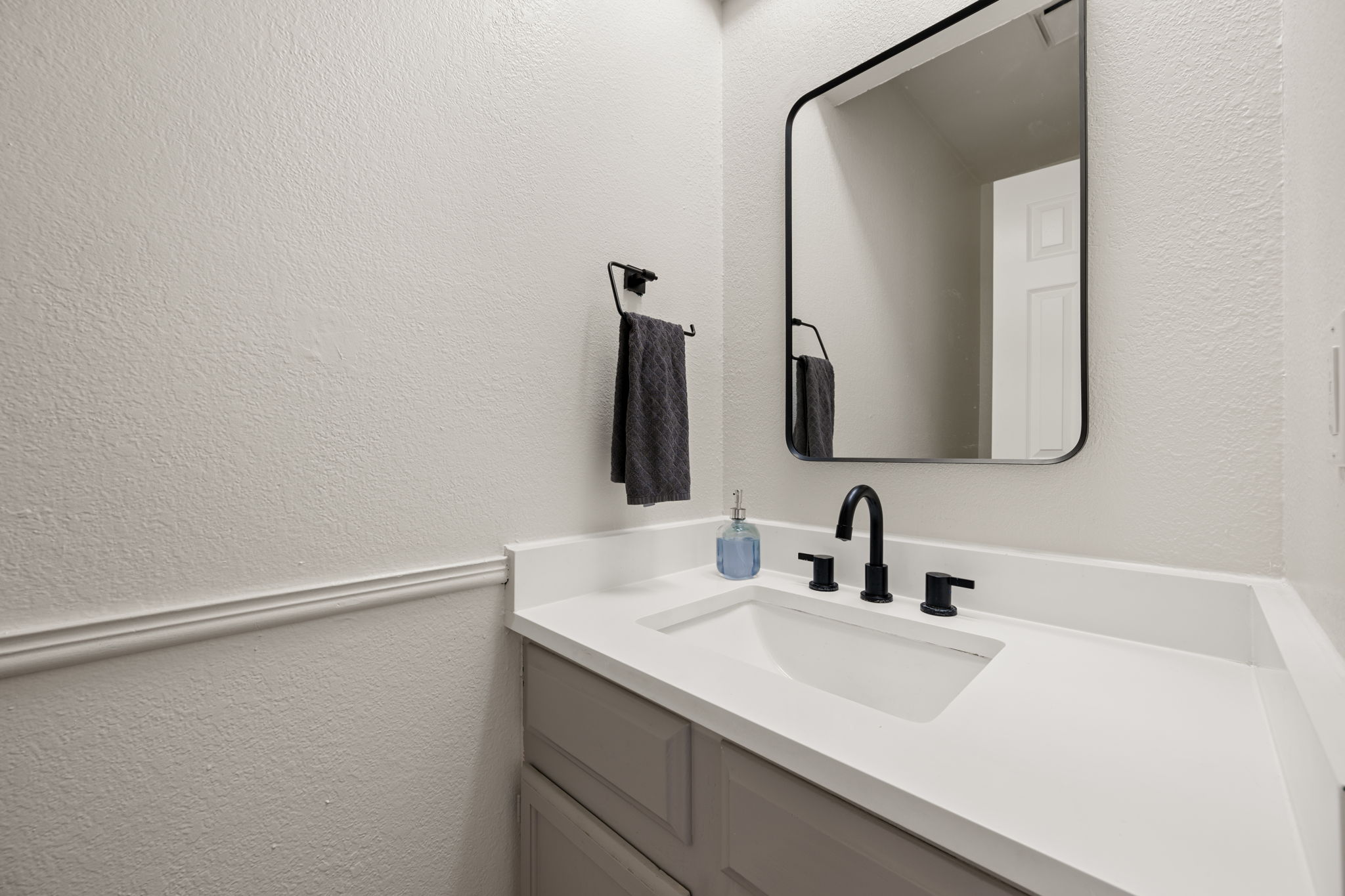 11942 Bittern Hollow Austin, TX 78758 - Photo 11 of 29 a bathroom with a sink and a mirror