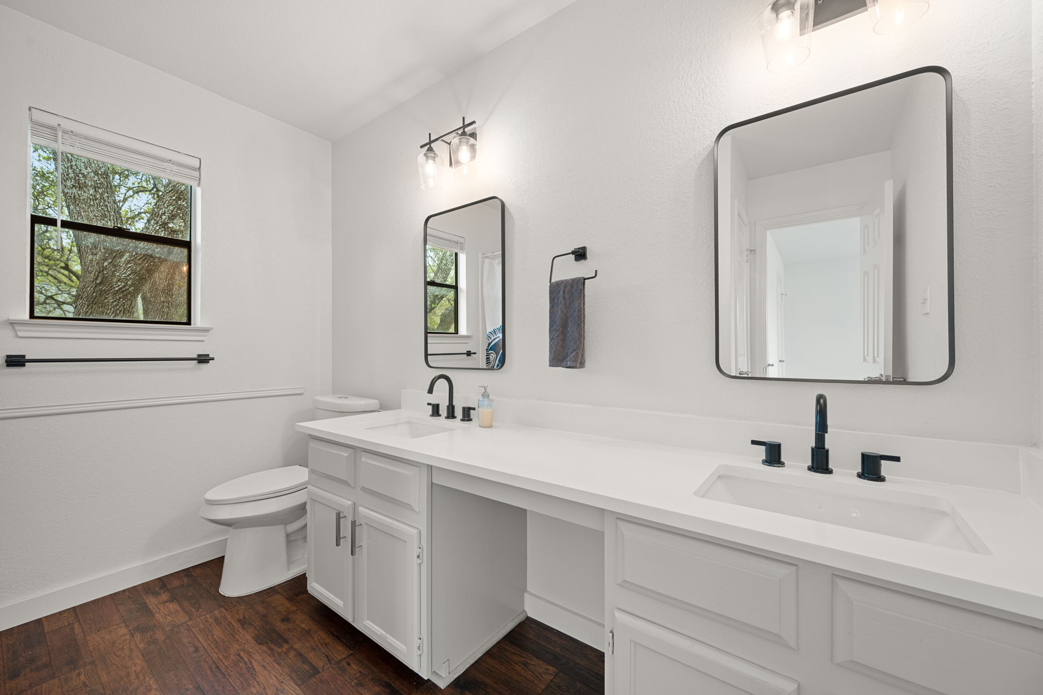 11942 Bittern Hollow Austin, TX 78758 - Photo 14 of 29 a bathroom with a toilet sink and mirror