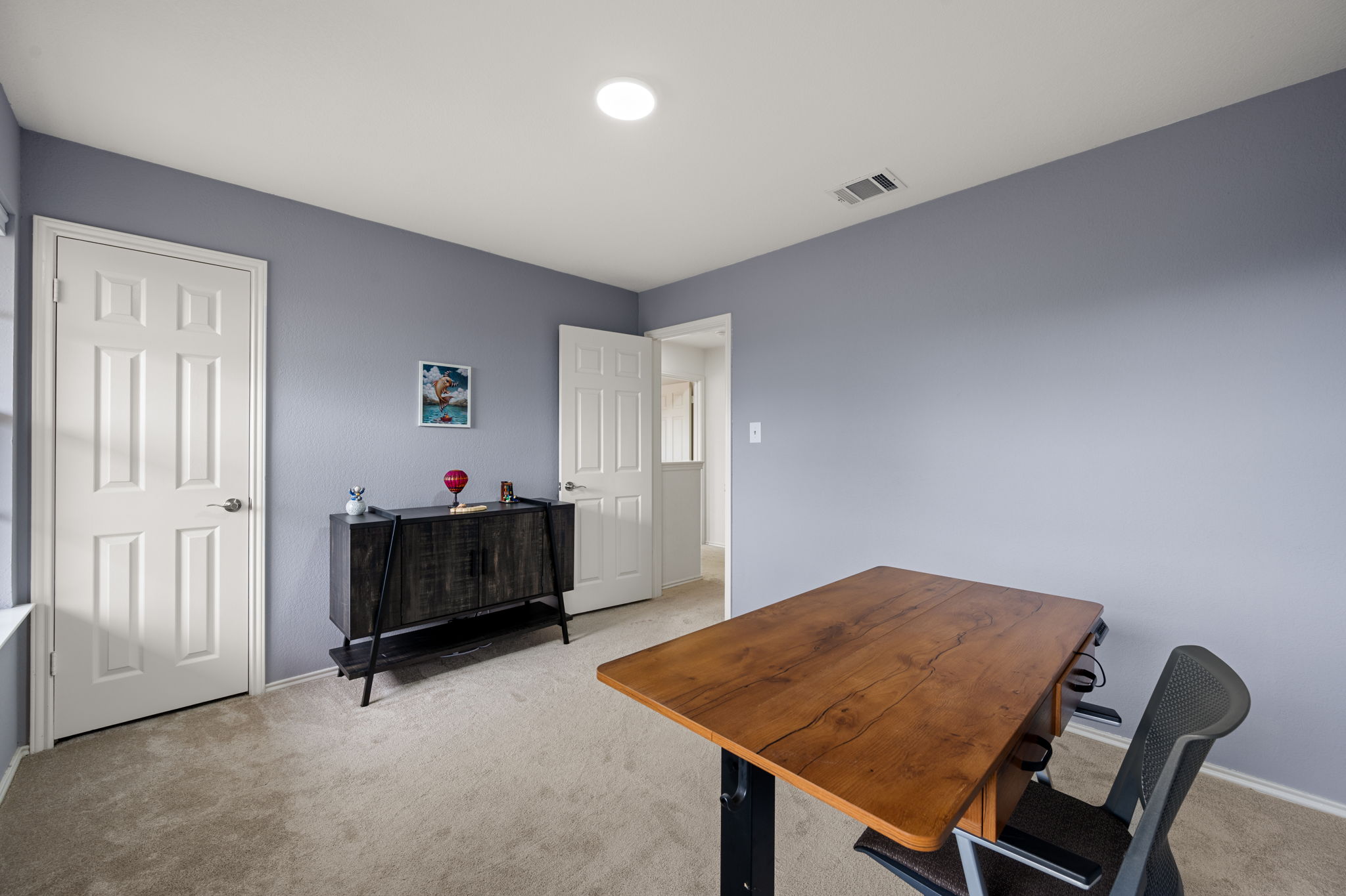 11942 Bittern Hollow Austin, TX 78758 - Photo 17 of 29 a bedroom with furniture and a window