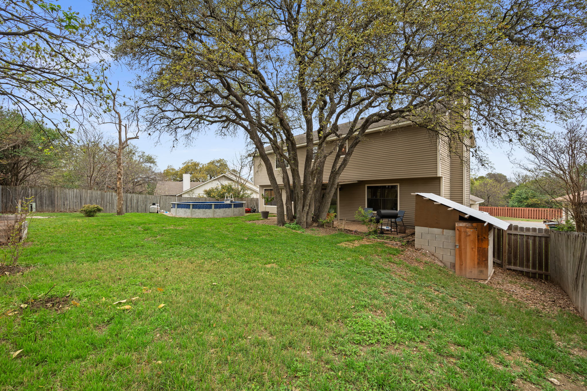 11942 Bittern Hollow Austin, TX 78758 - Photo 20 of 29 a view of a house with backyard and sitting area