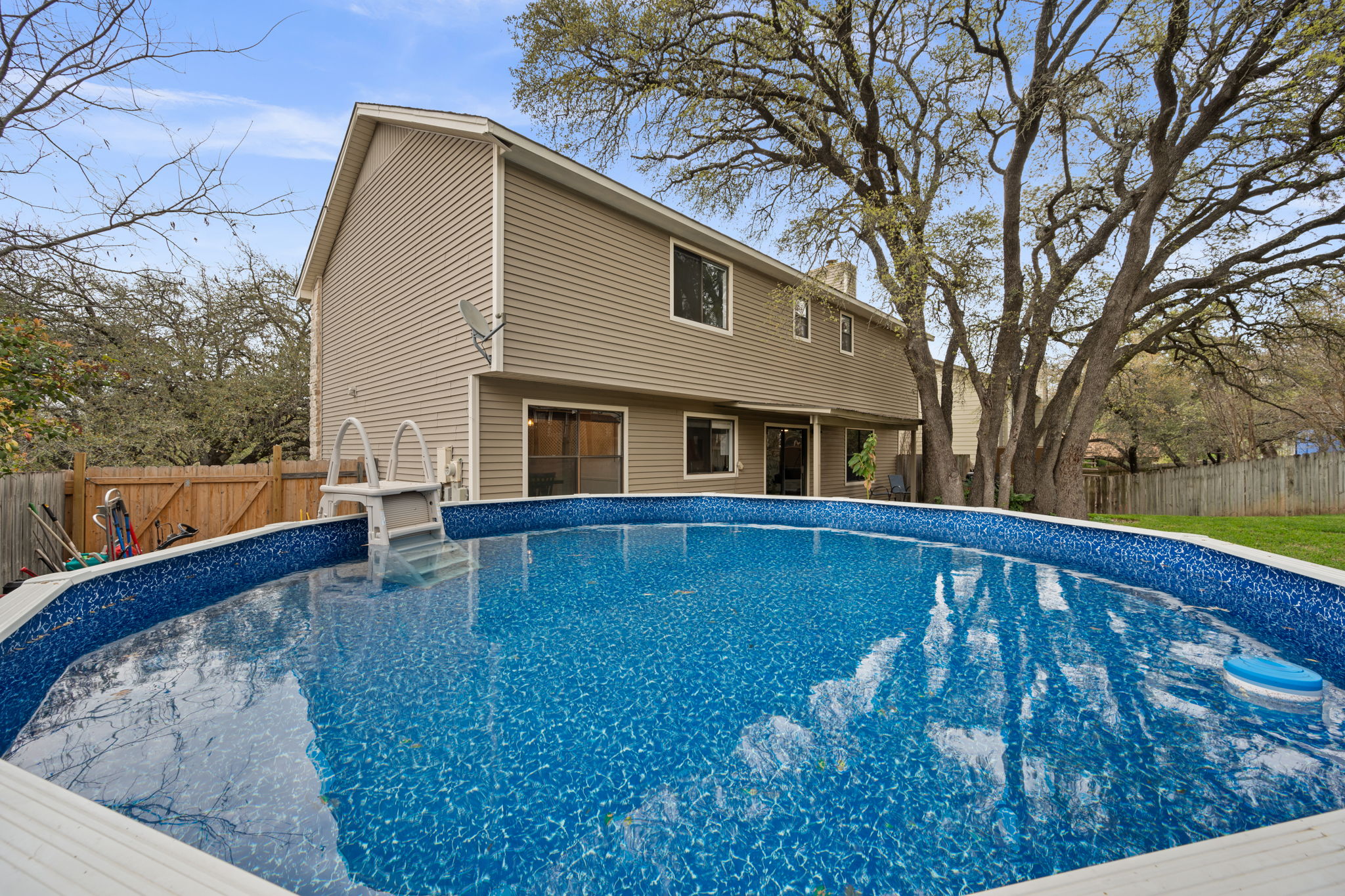11942 Bittern Hollow Austin, TX 78758 - Photo 22 of 29 a view of a house with a backyard