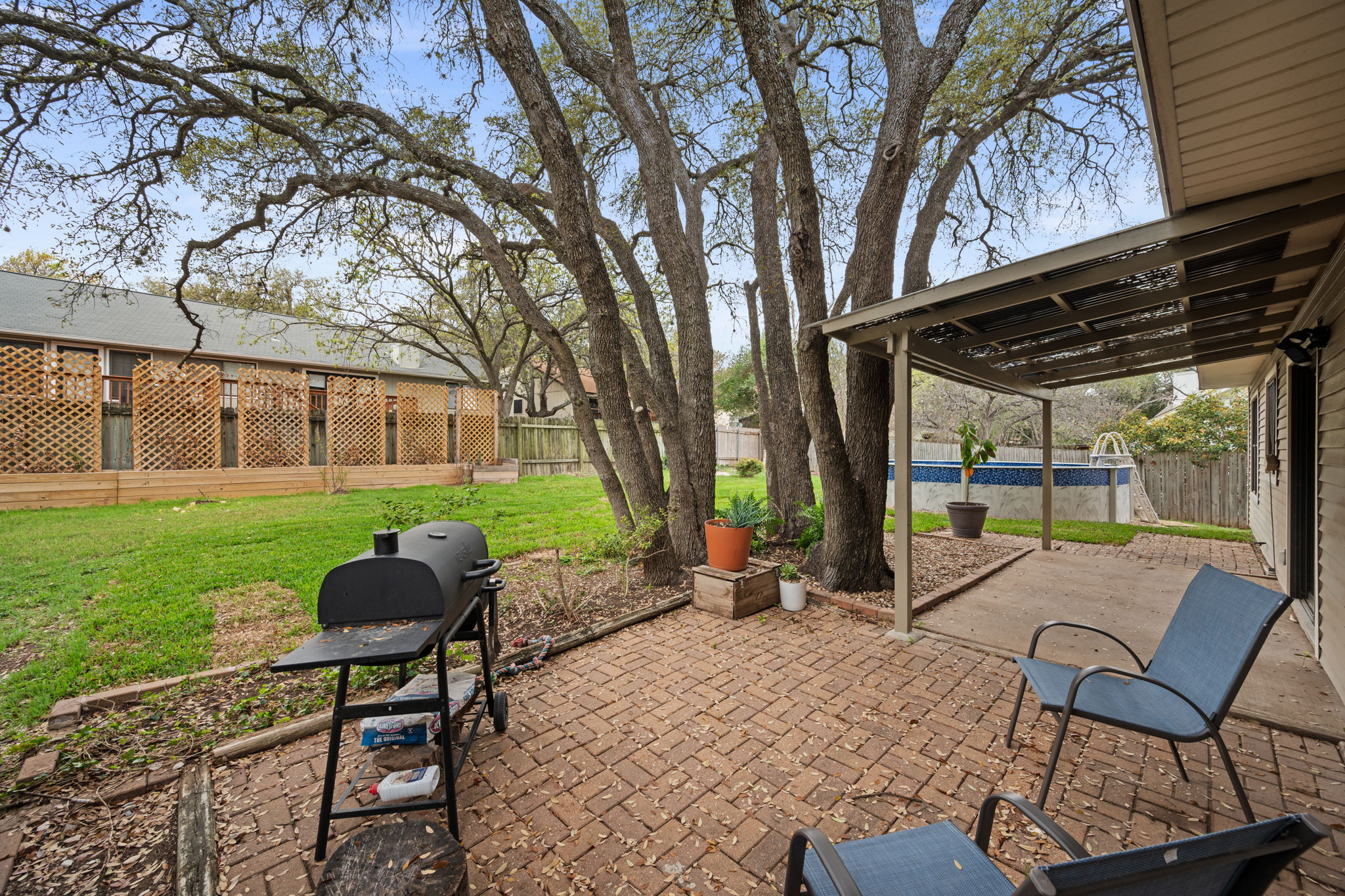 11942 Bittern Hollow Austin, TX 78758 - Photo 24 of 29 a backyard of a house with table and chairs