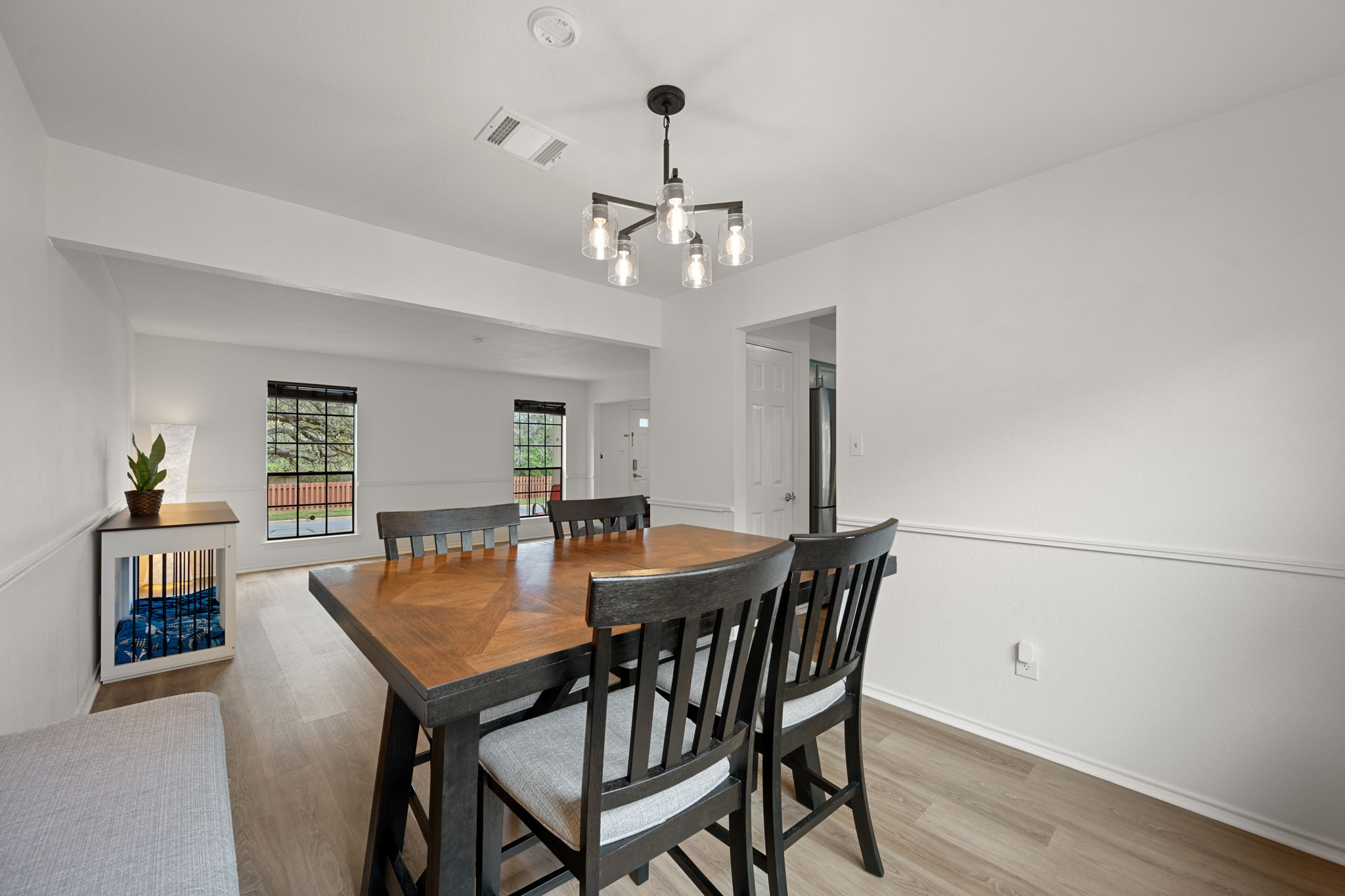 11942 Bittern Hollow Austin, TX 78758 - Photo 4 of 29 a view of a dining room with furniture and wooden floor