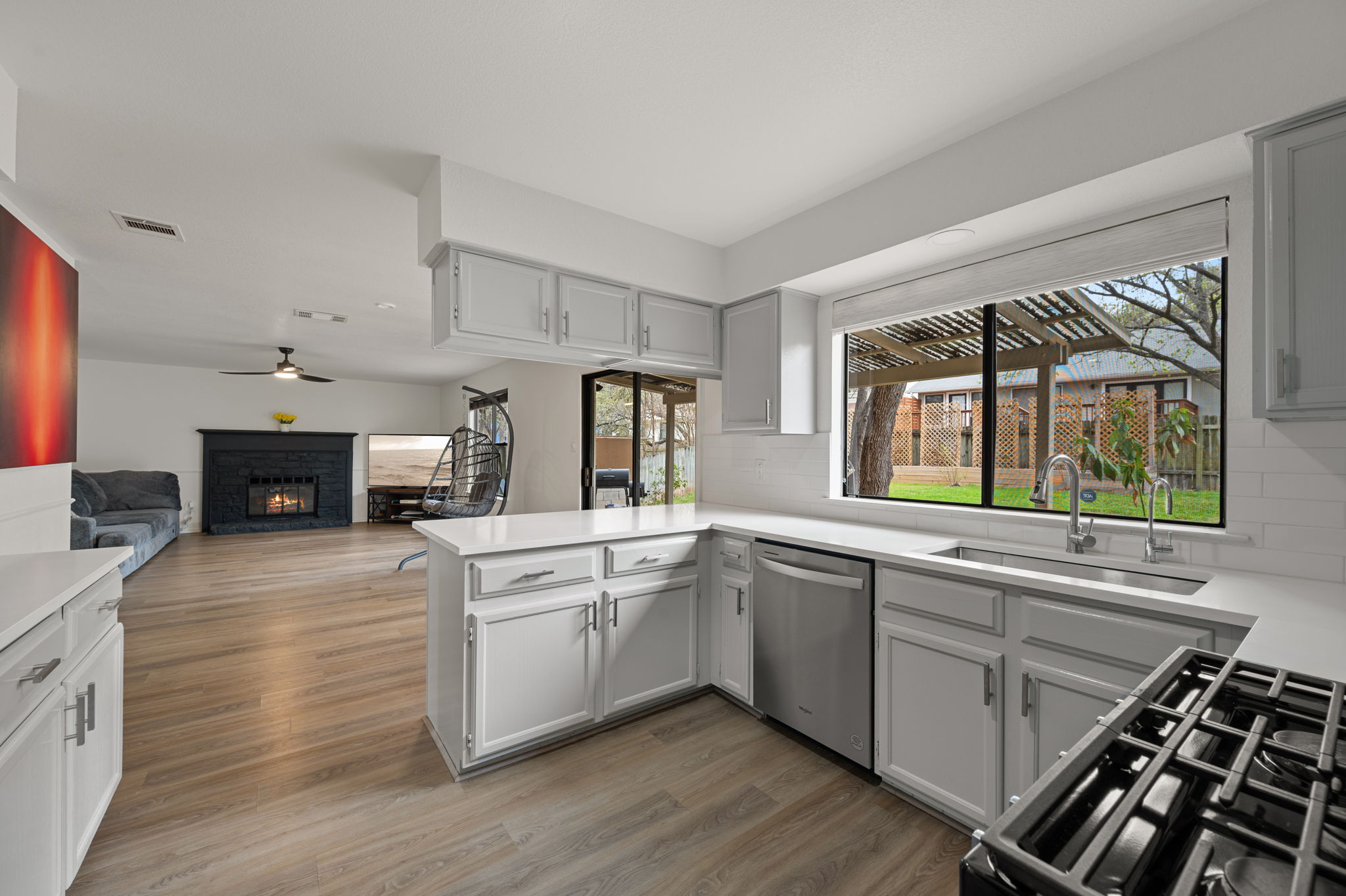 11942 Bittern Hollow Austin, TX 78758 - Photo 7 of 29 a kitchen with a sink stove and cabinets