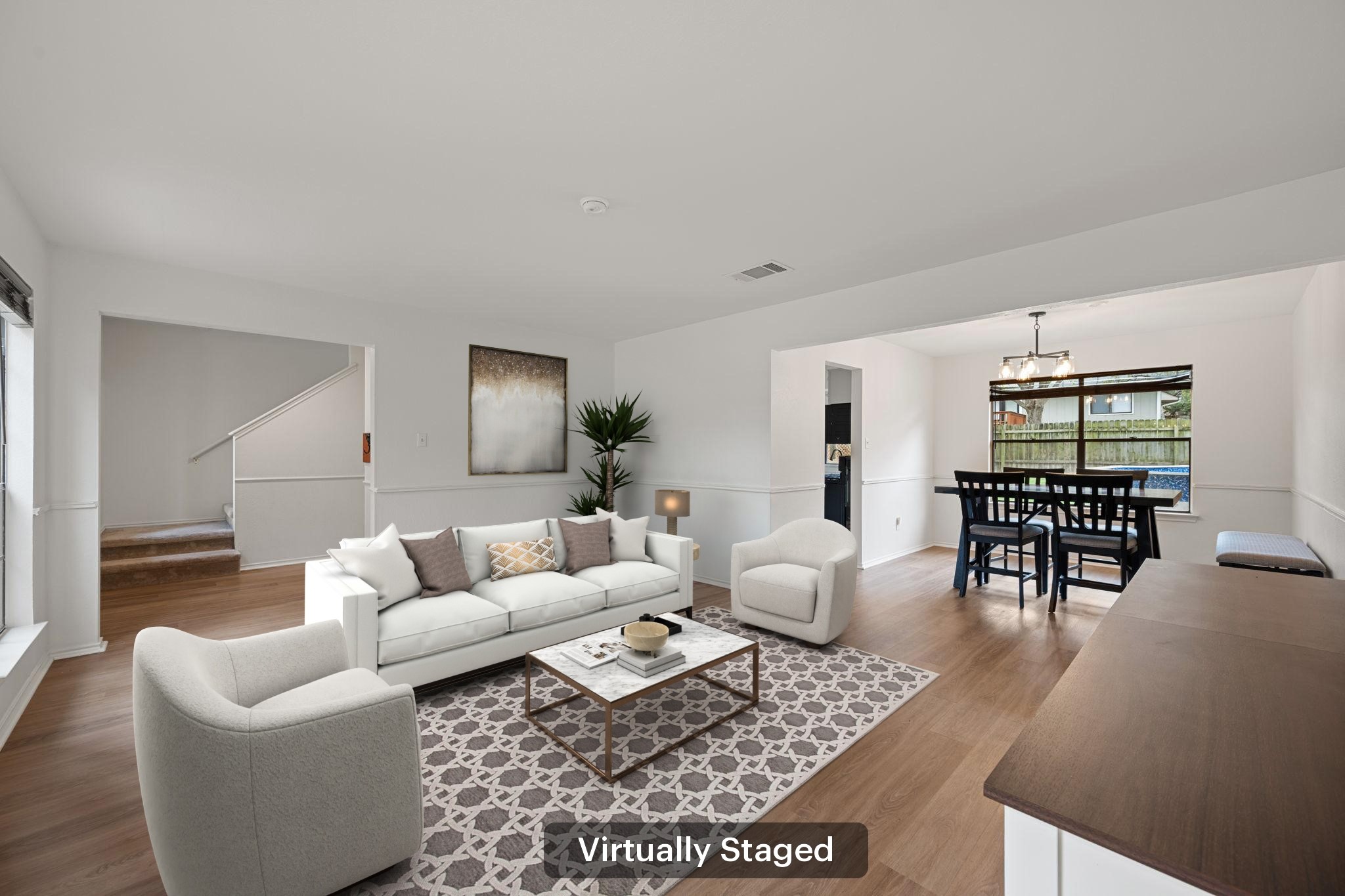 11942 Bittern Hollow Austin, TX 78758 - Photo 10 of 29 a living room with furniture a rug and a table