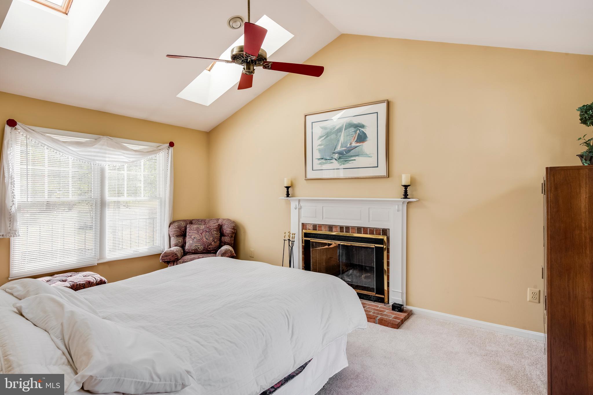 314 Canterfield Road Annapolis, MD 21403 - Photo 9 of 37 a bedroom with a bed and a fireplace