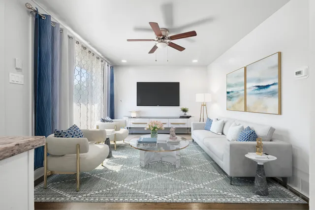 a living room with furniture and a large window