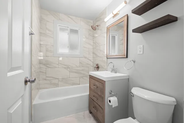 a bathroom with a sink toilet and bathtub