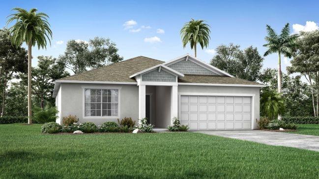 1231 Coble Road Spring Hill, FL 34608 - Photo 1 of 1 a front view of a house with a garden