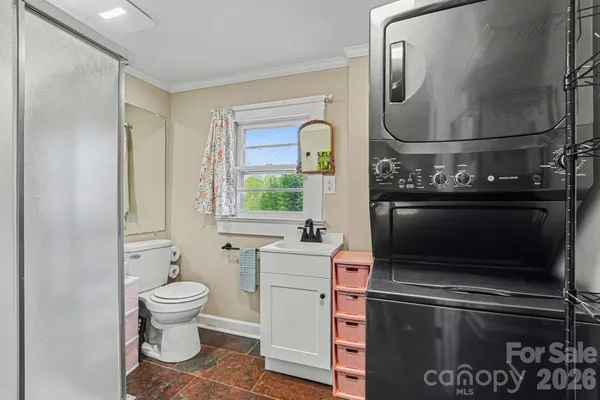 a room with a stove and a mirror