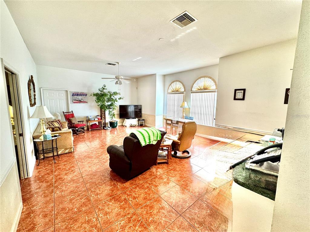 2605 Bayview Street Sebring, FL 33870 - Photo 10 of 11 a living room with furniture and a large window