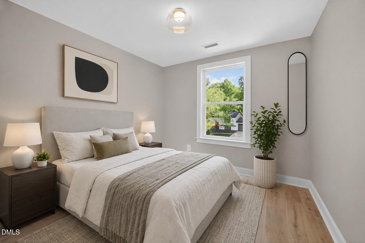 313 Crown Oaks Drive Raleigh, NC 27615 - Photo 20 of 60 a bedroom with a bed and a window