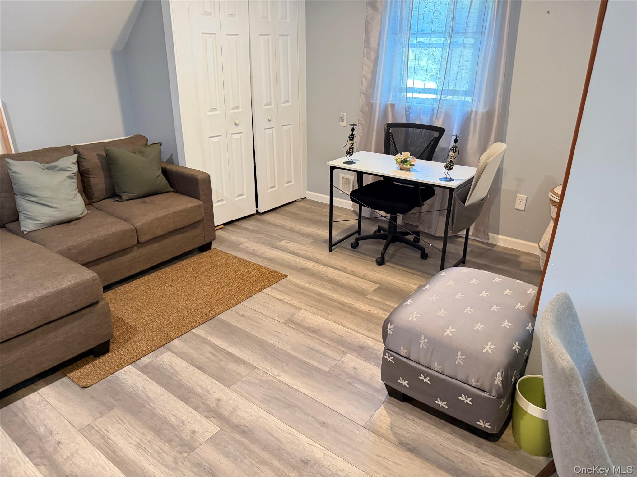 17 Mallory Road Spring Valley, NY 10977 - Photo 23 of 26 a living room with furniture and a wooden floor