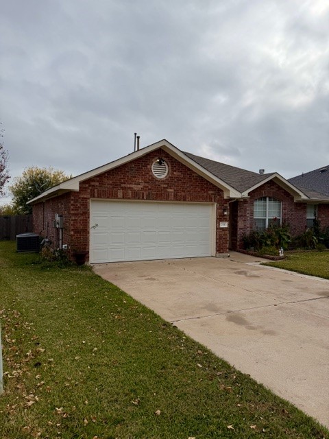 708 Ranier Lane Round Rock, TX 78665 - Photo 2 of 20 Single story home featuring brick siding, driveway, an attached garage, and a front yard