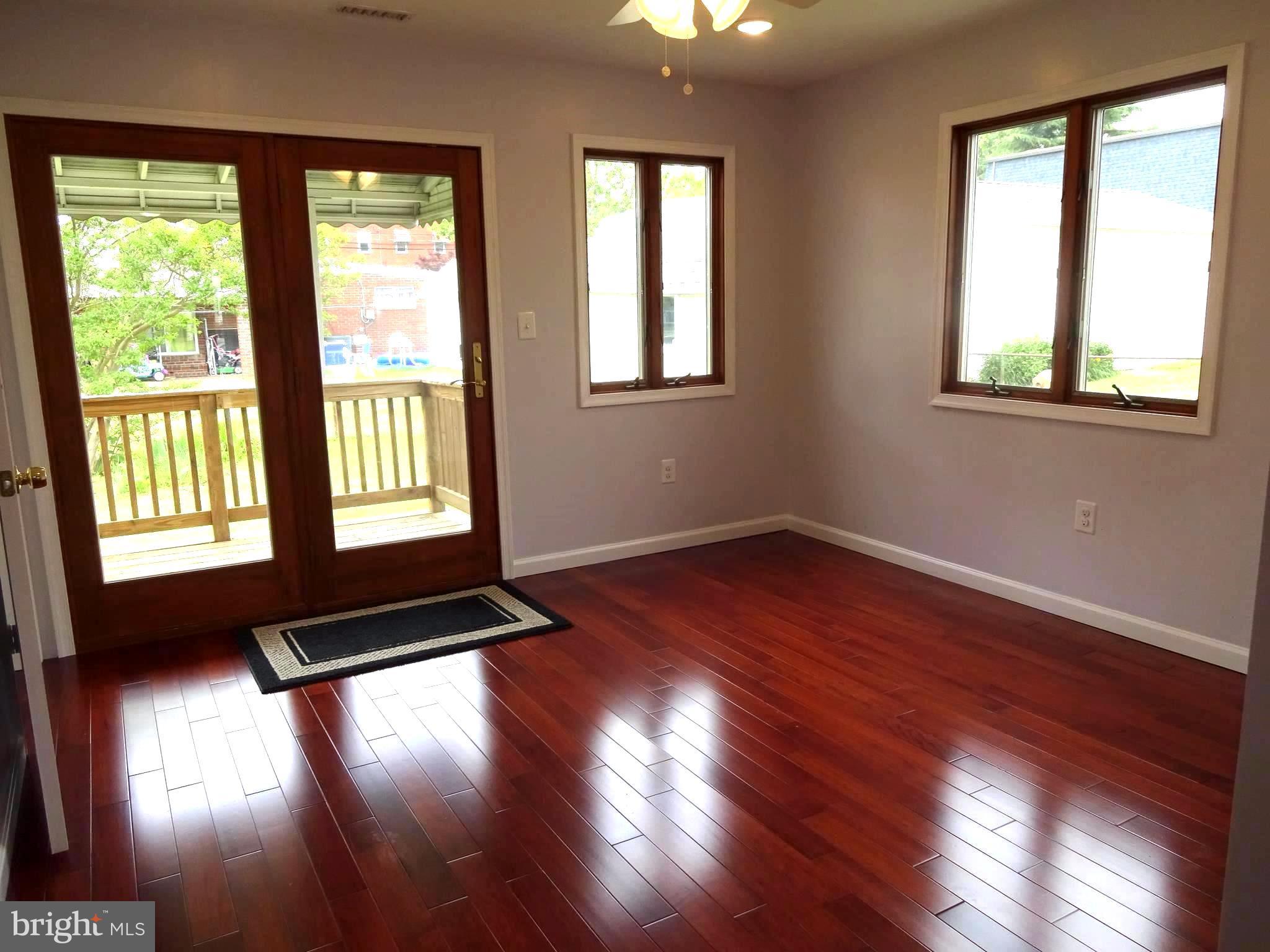3004 Baybriar Road Baltimore, MD 21222 - Photo 12 of 24 Family Room w/ New Wood Floors, Freshly Painted