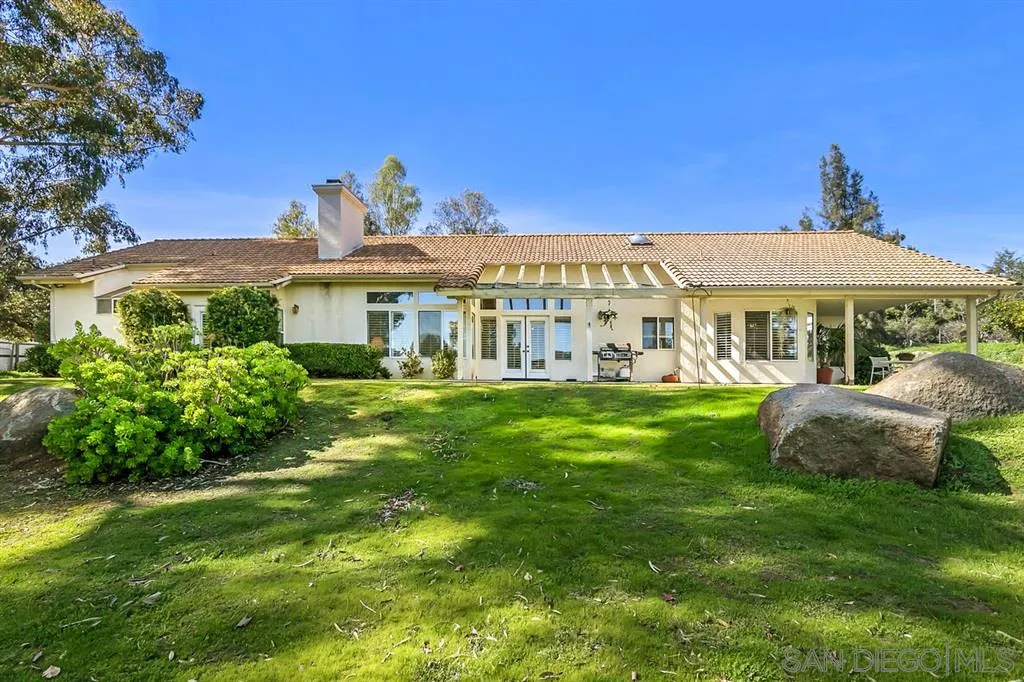 a view of a house with a garden