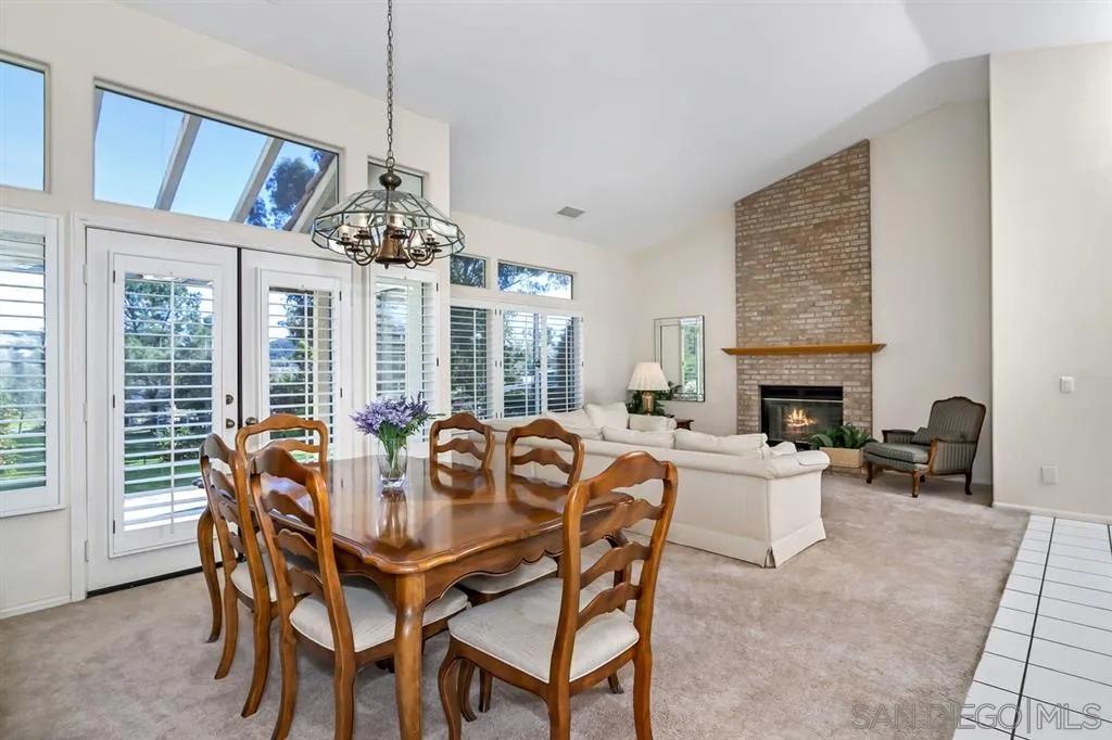 1631 Dewitt Estates Road Alpine, CA 91901 - Photo 13 of 25 a dining room with furniture a chandelier and wooden floor