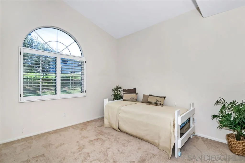 1631 Dewitt Estates Road Alpine, CA 91901 - Photo 18 of 25 a bedroom with a bed and a window