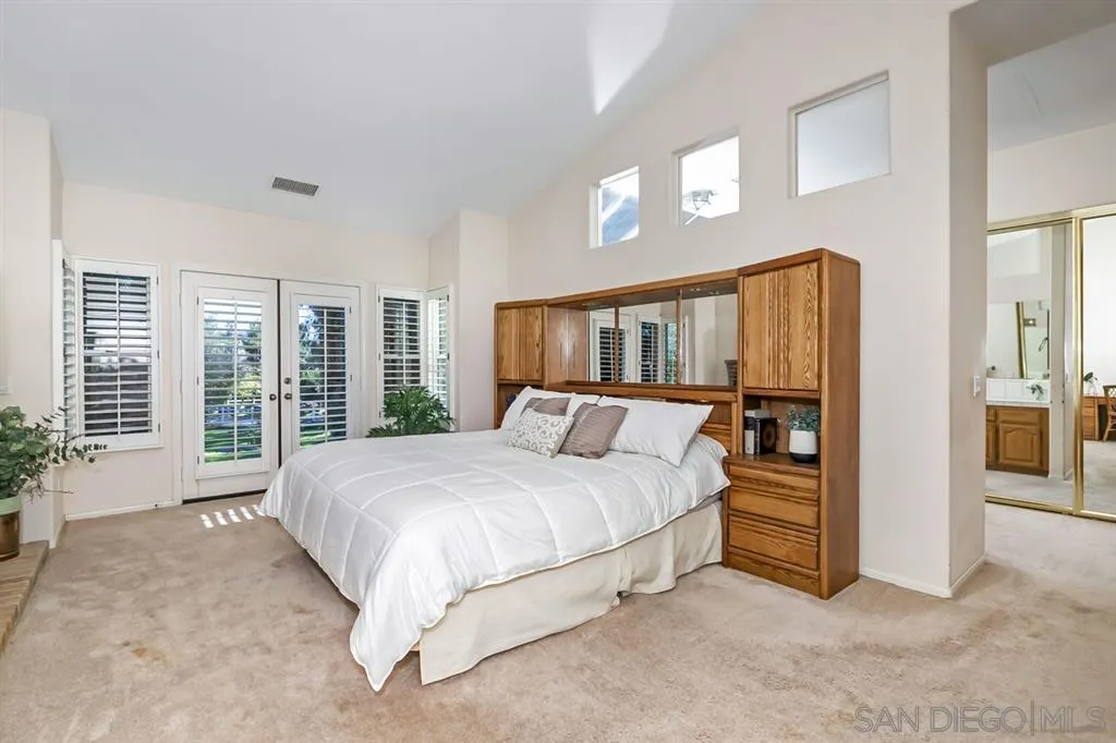 1631 Dewitt Estates Road Alpine, CA 91901 - Photo 19 of 25 a bedroom with a large bed and a large window