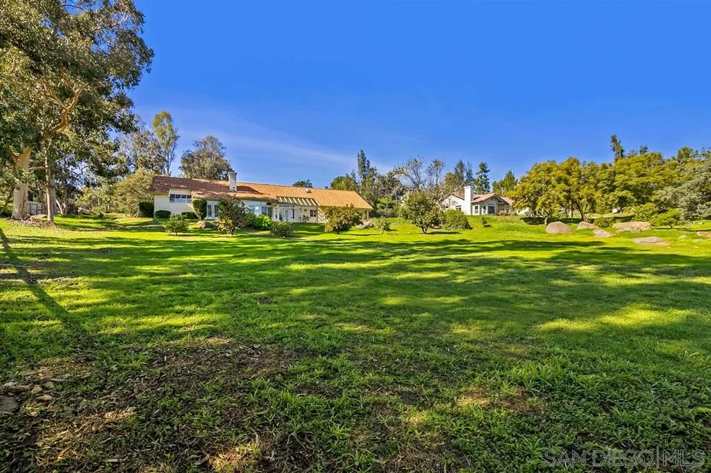 1631 Dewitt Estates Road Alpine, CA 91901 - Photo 24 of 25 a view of a grassy field with an trees