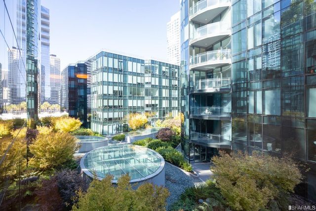 a kitchen with cabinets and stainless steel appliances