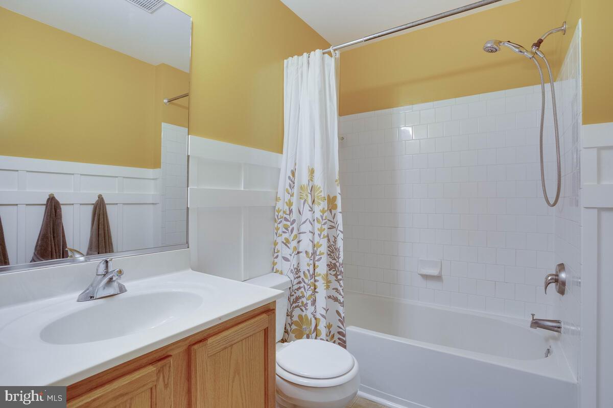3369 Evans Road Huntingtown, MD 20639 - Photo 45 of 59 a bathroom with a sink a toilet and shower