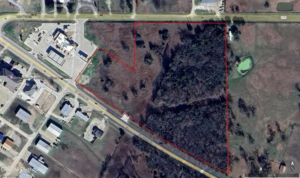 an aerial view of house with a yard