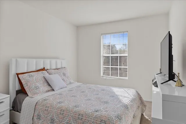 a view of room with window and ceiling fan