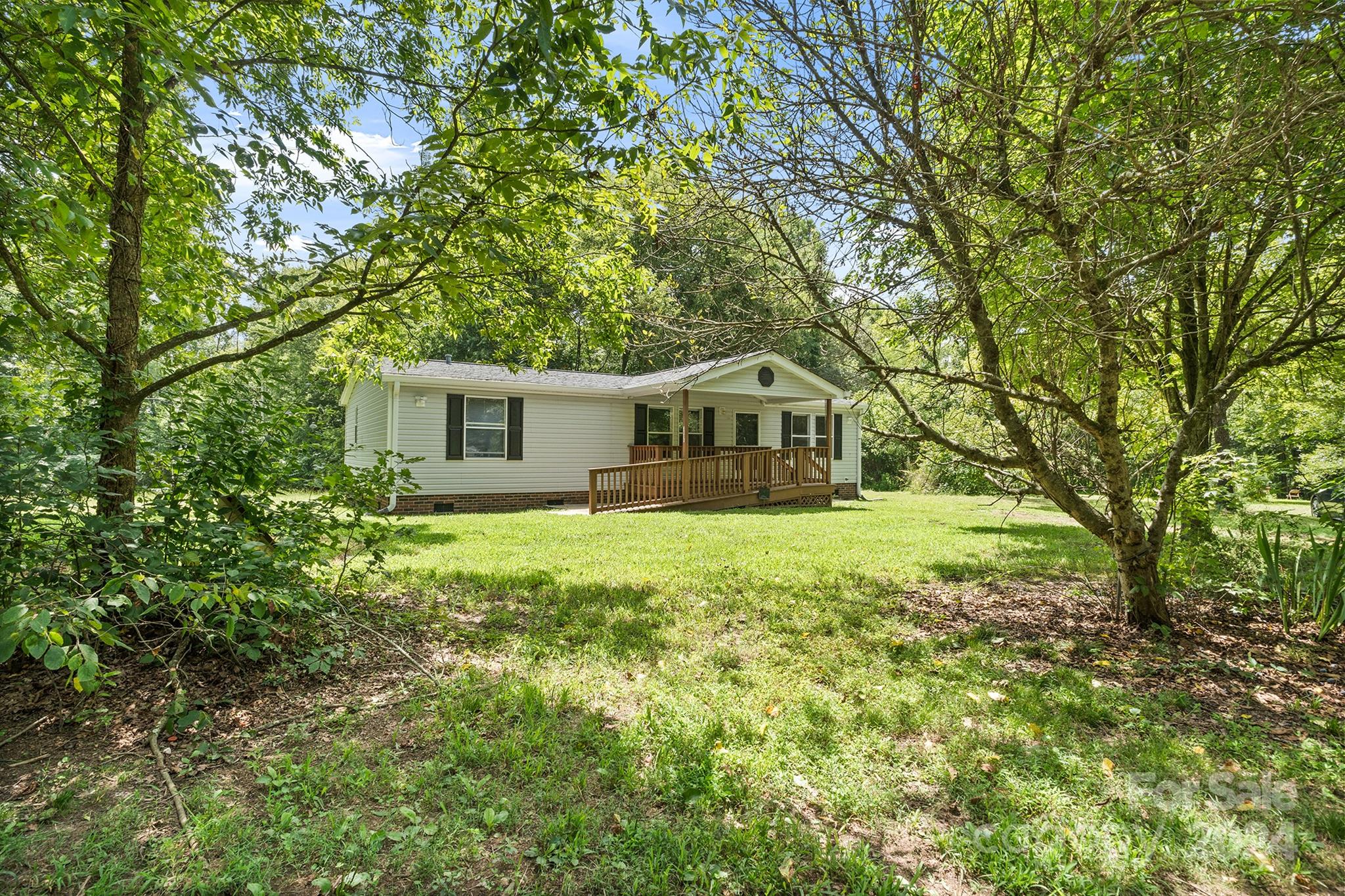3616 East Brief Road Monroe, NC 28110 - Photo 3 of 30 a house view with a garden space