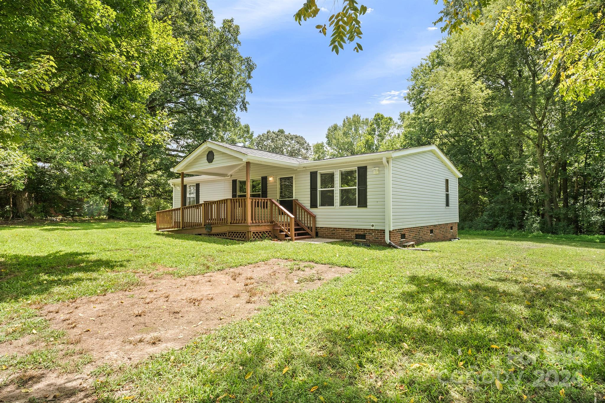 3616 East Brief Road Monroe, NC 28110 - Photo 4 of 30 a view of a house with a backyard